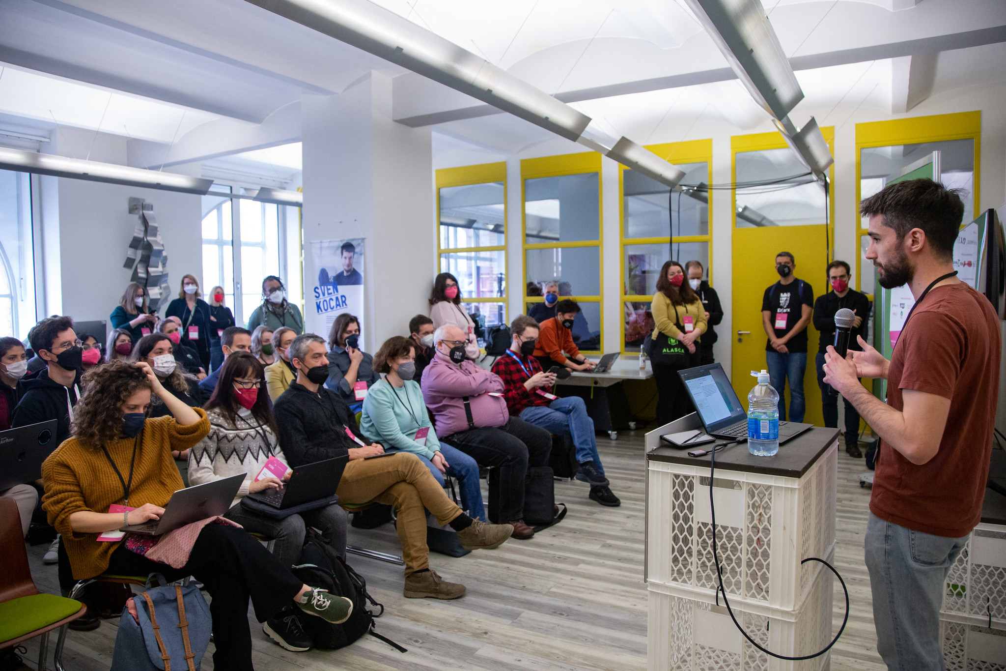 Photo of the audience and speaker during a talk on stage 2 at FOSS Backstage 2023